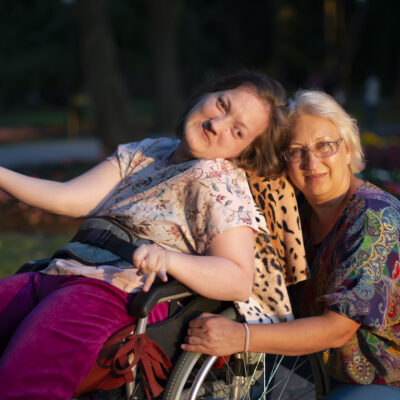 Can an existing 65-year-old single resident request to have their disabled adult child move into the property